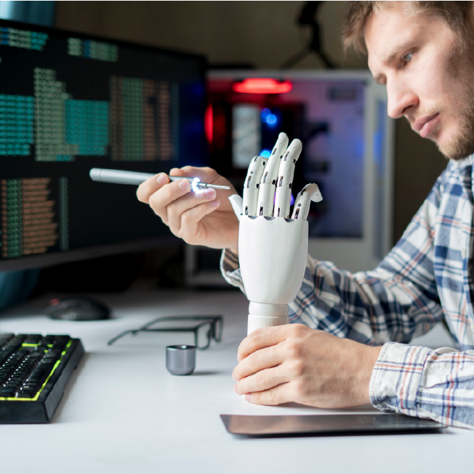 A person running computer data about robotics.