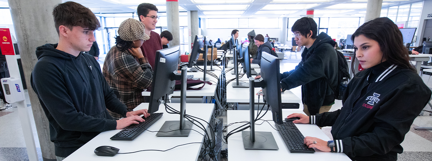 Group of students using computers at Parks Library. 